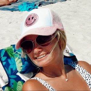 pink smiley face trucker hat